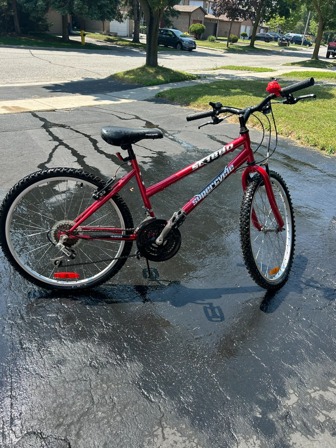 Red Bicycle with Bell, Brakes, and Kickstand