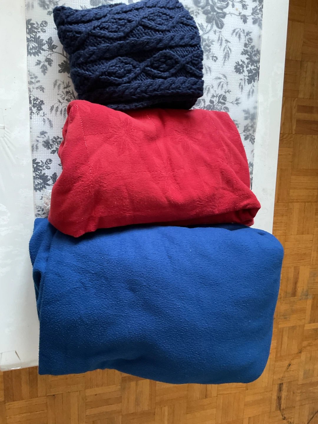 Blue Knit Beanie and Red/Blue Blankets