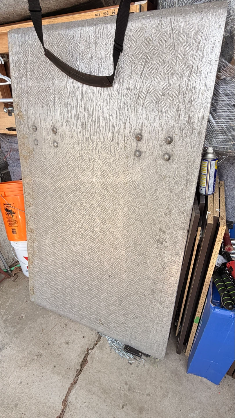 Aluminum diamond plate shield with strap