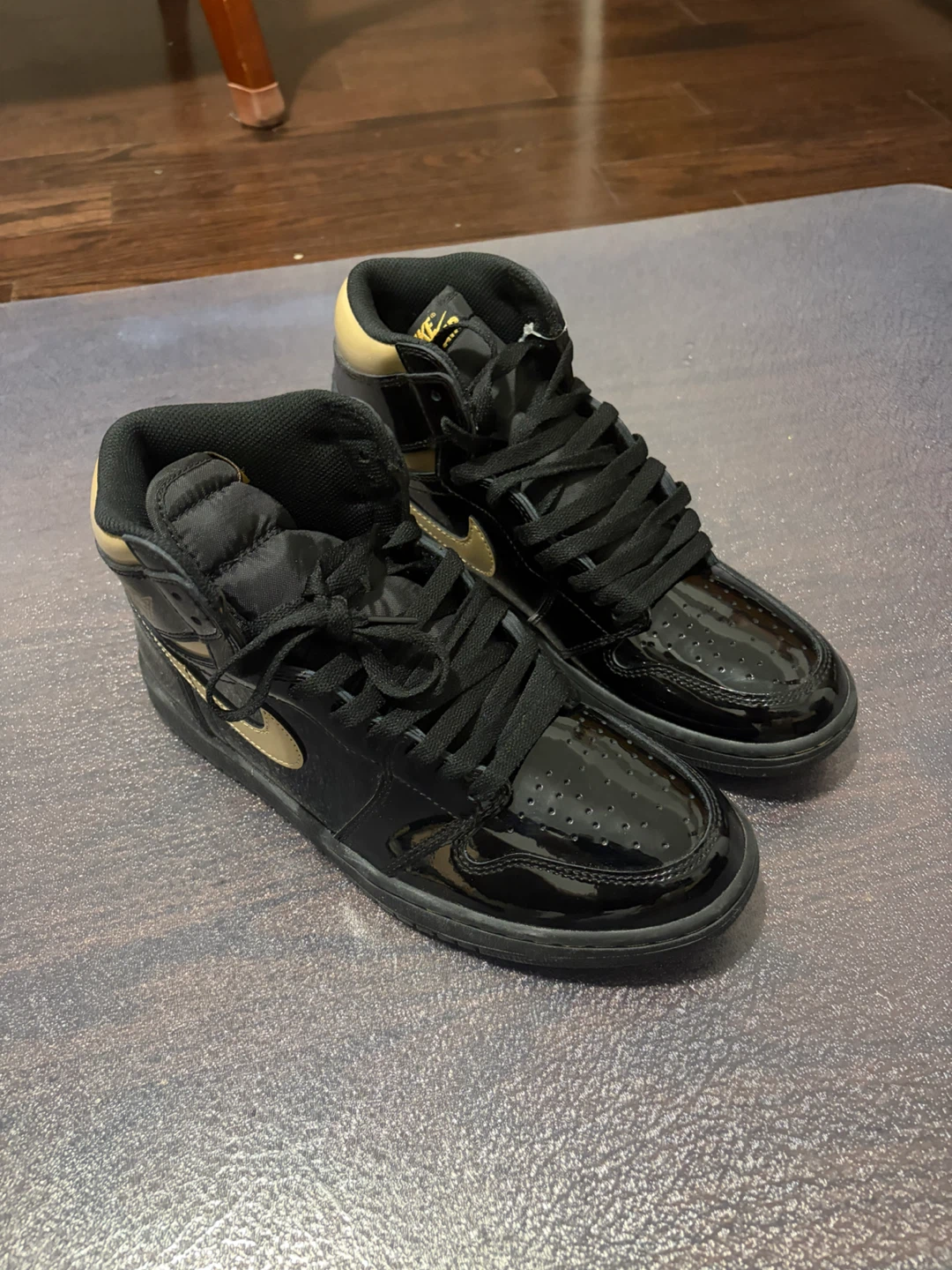 Air Jordan 1 High Black Gold Patent Leather Sneakers