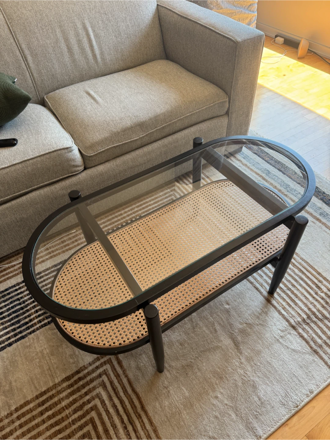 Oval Coffee Table with Glass Top and Rattan Shelf
