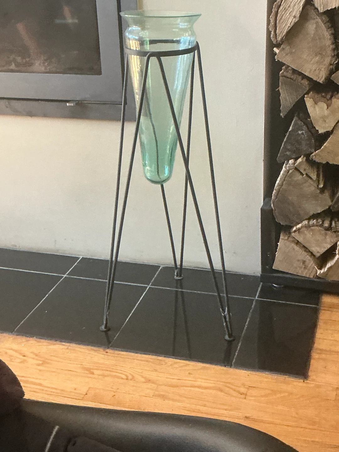 Floor standing trumpet vase with black steel tripod stand