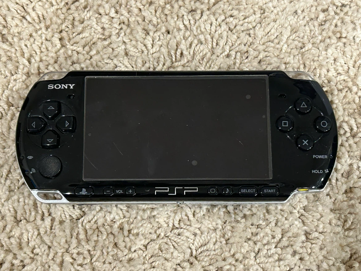 PSP + case, game, and movie