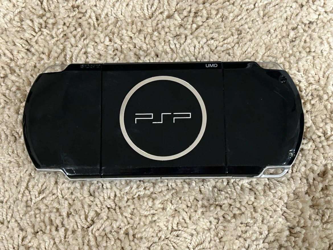 PSP + case, game, and movie - photo 2