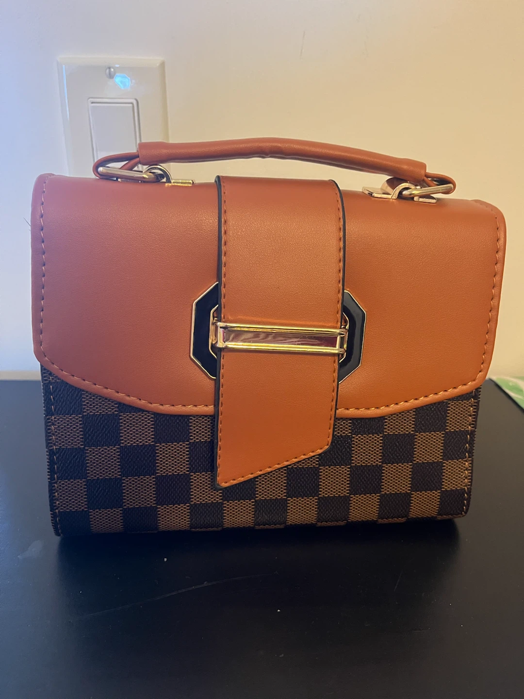 Brown checkered handbag with tan accents