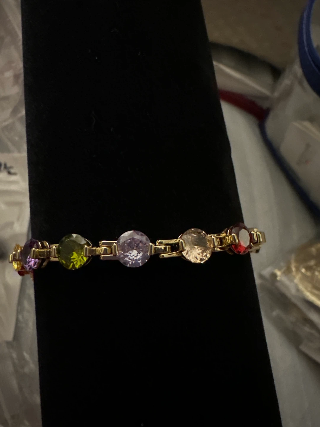 Gold-laminated tennis bracelet with colorful gemstones