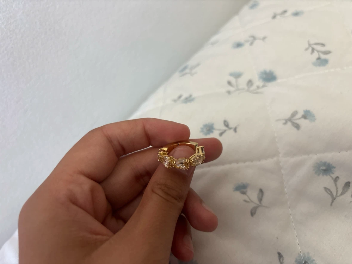 Gold tone ring with clear stones