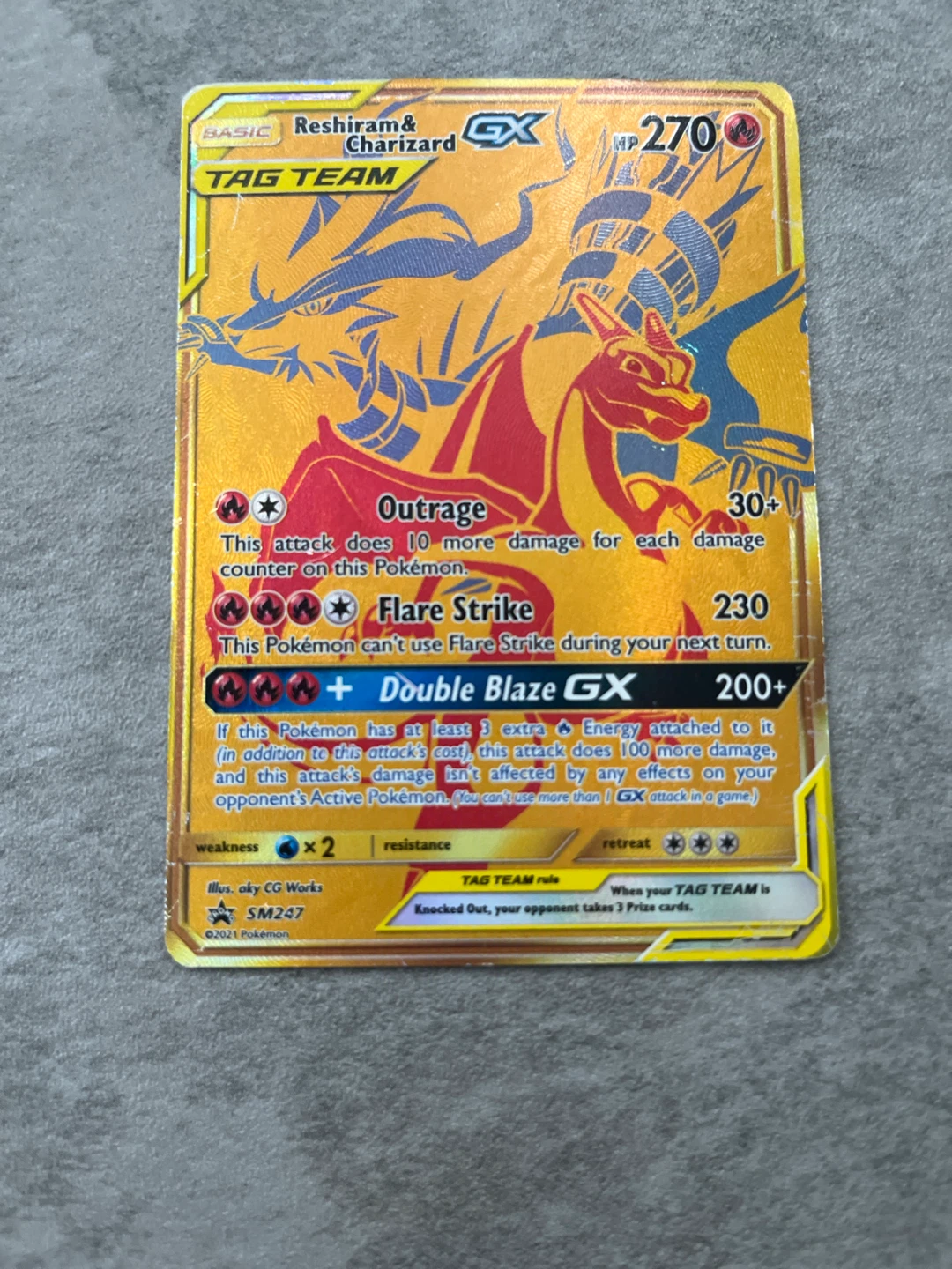 Gold Reshiam and Charizard Tag Team GX