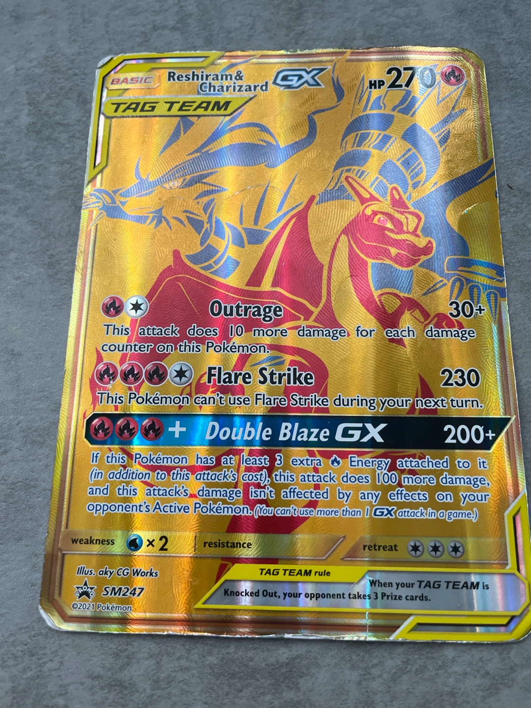 Jumbo Gold Reshiam and Charizard Tag Team GX