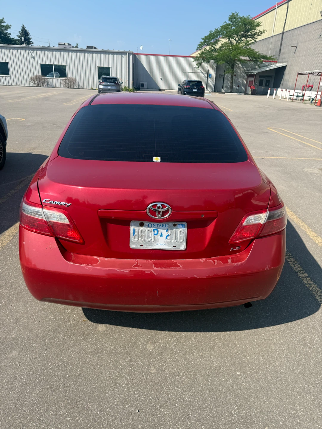 Red Toyota Camry LE Sedan