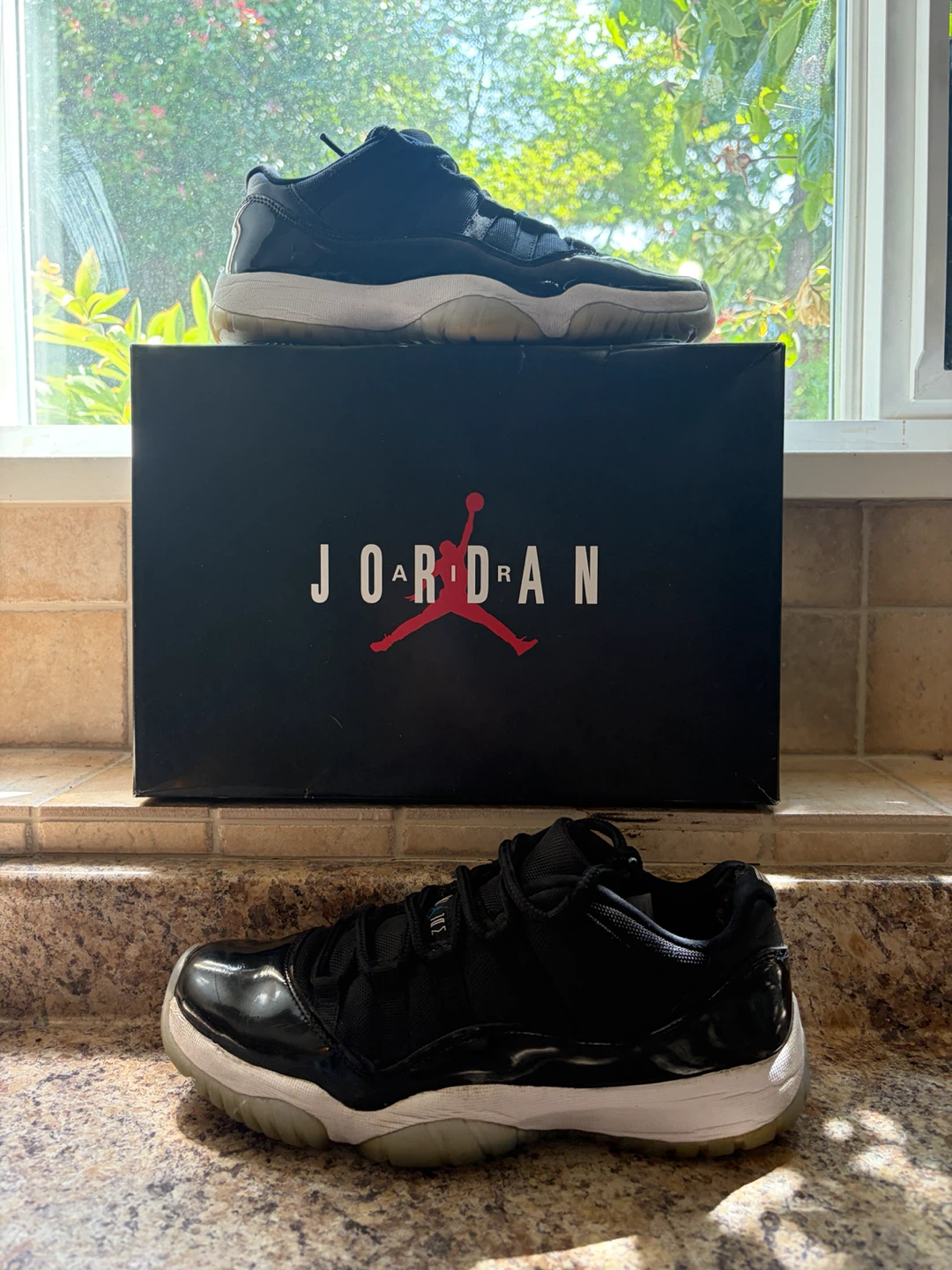 Jordan 11 Black Patent Leather Sneakers