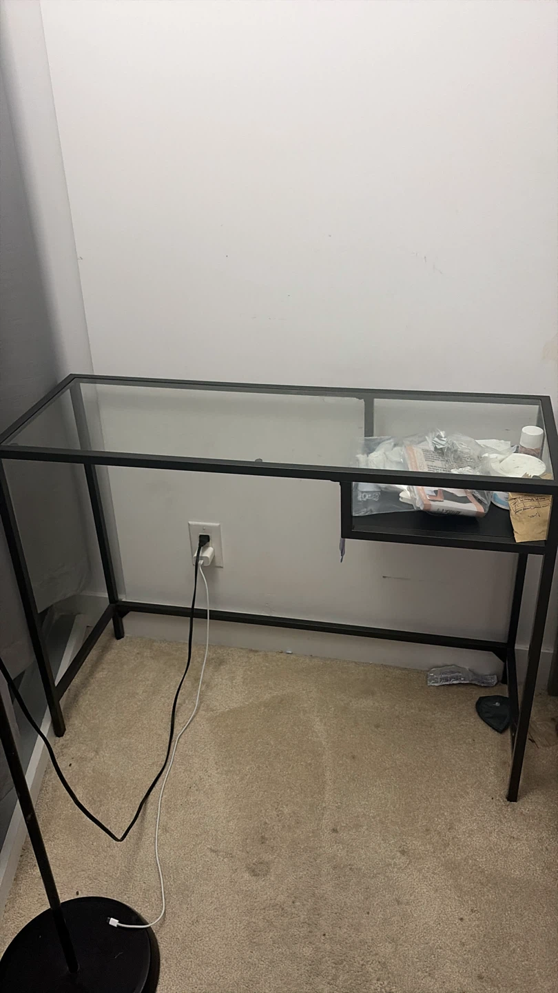 Glass top desk with black metal frame