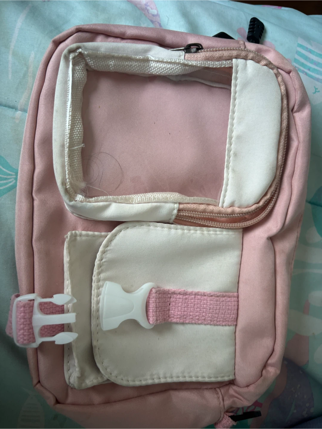 Pink crossbody bag with the strap