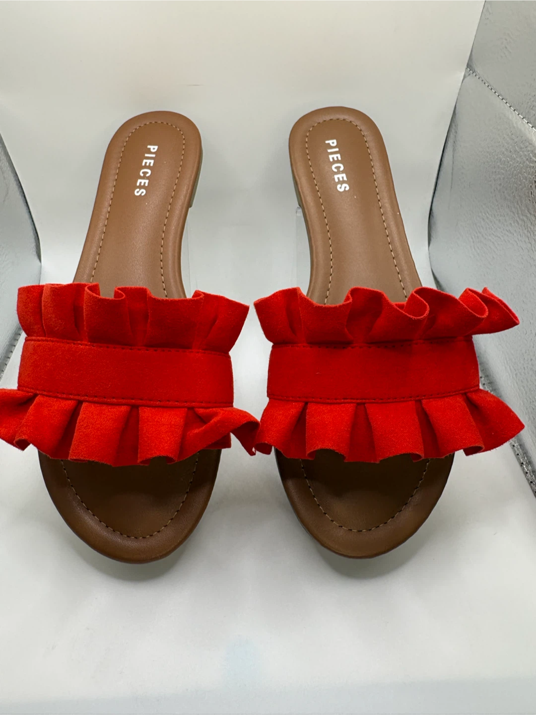 7 - Orange ruffled slide sandals by Pieces