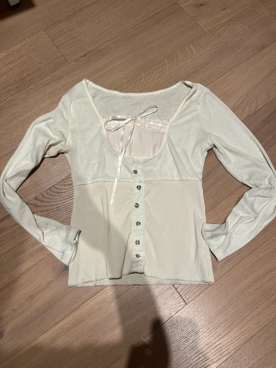 Cream ribbed button-up top with lace trim