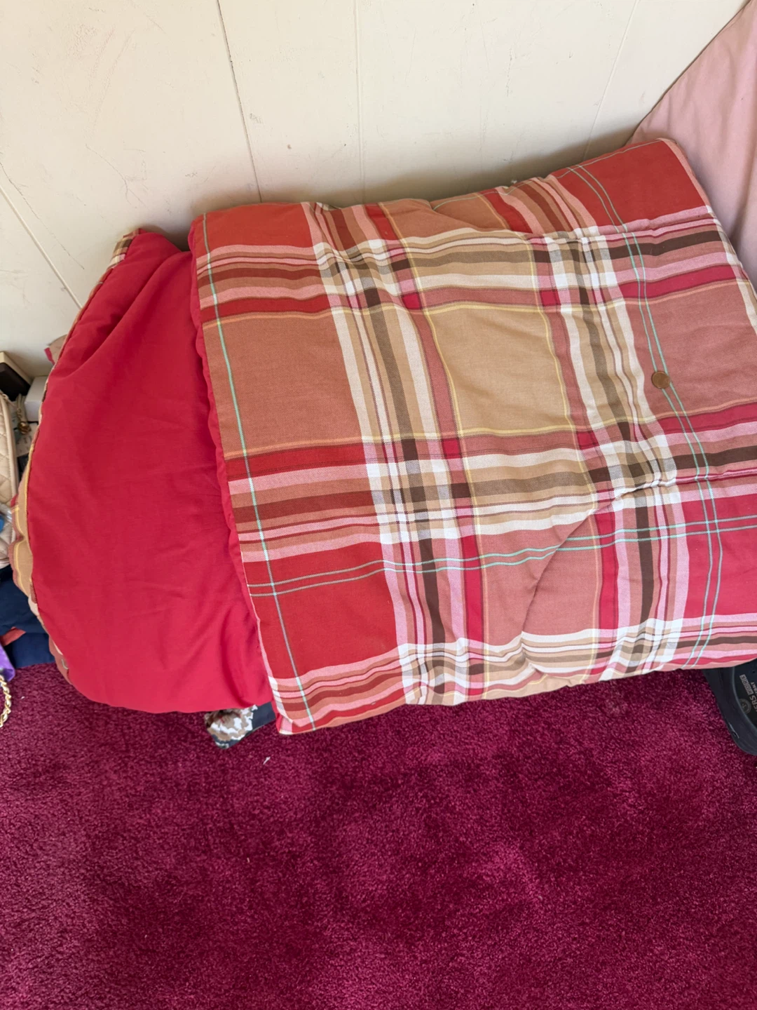 Plaid Comforter with Red Pillow
