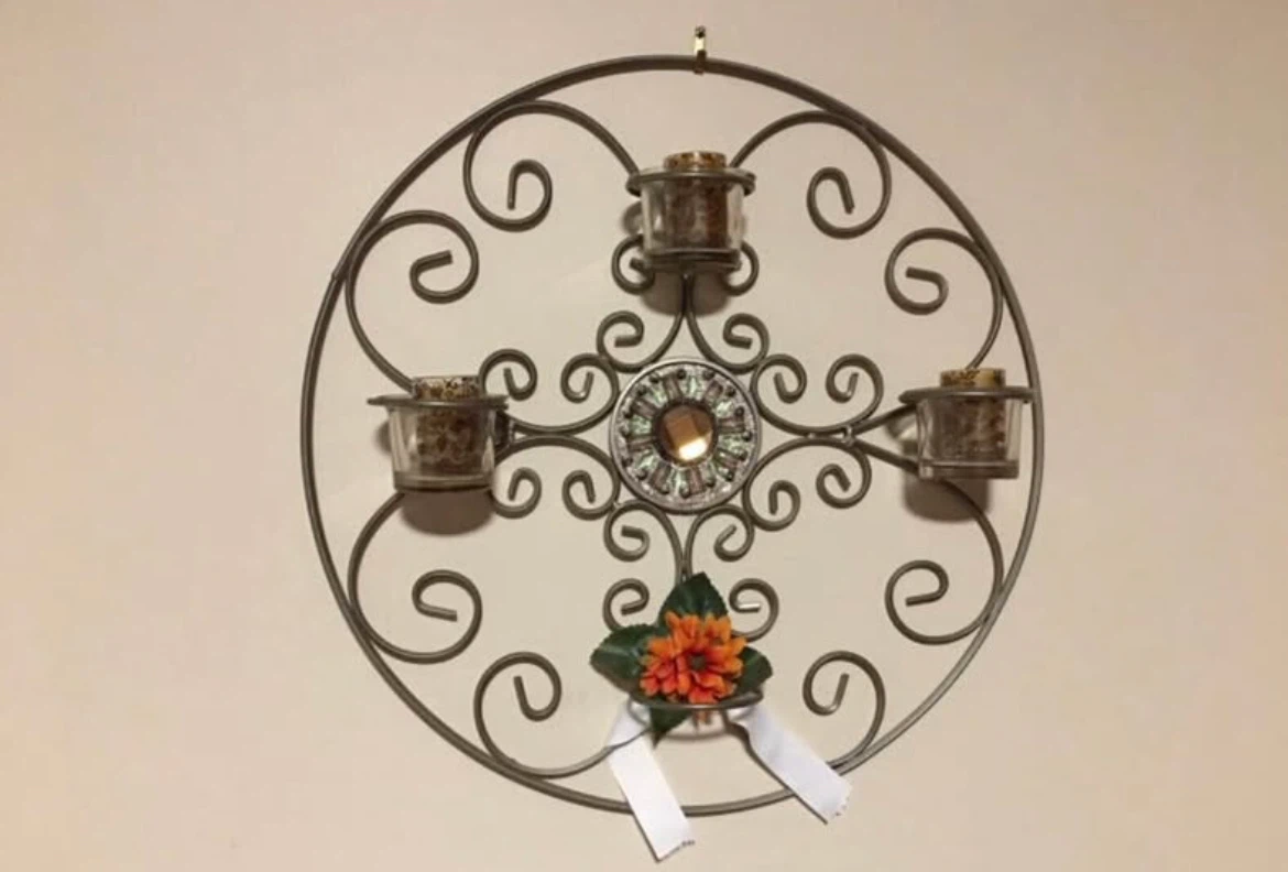 Ornate Metal Wall Candle Holder with Floral Accent