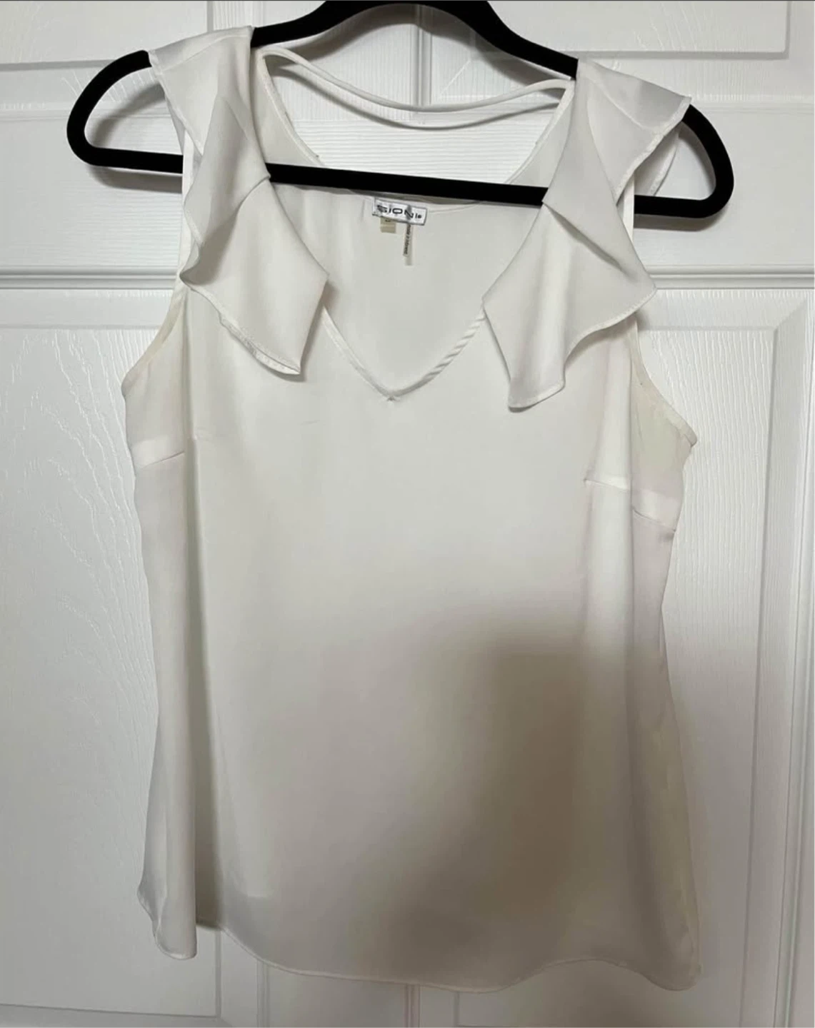 White Ruffle Sleeveless Blouse