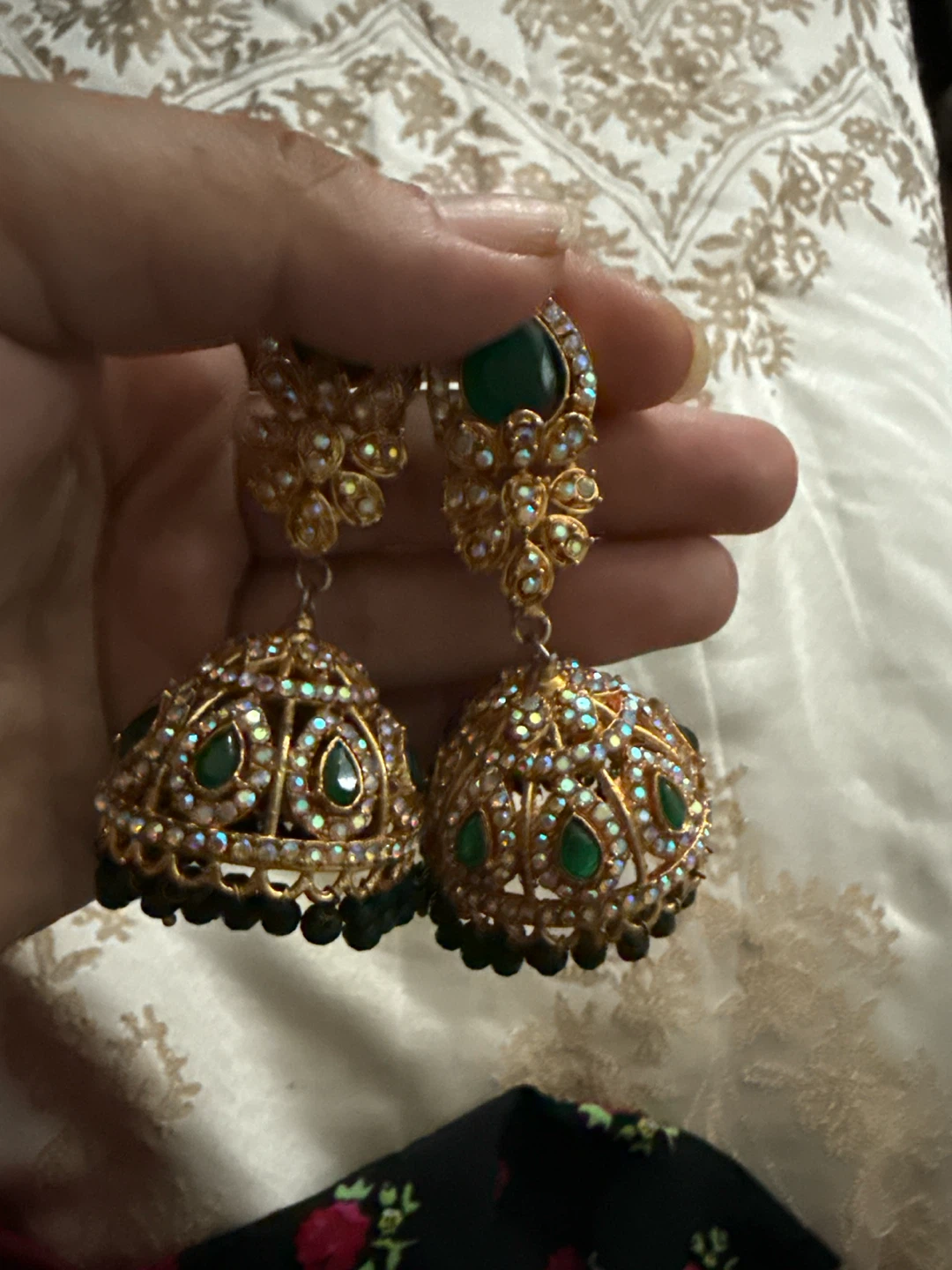 Gold Jhumka Earrings with Green Stones