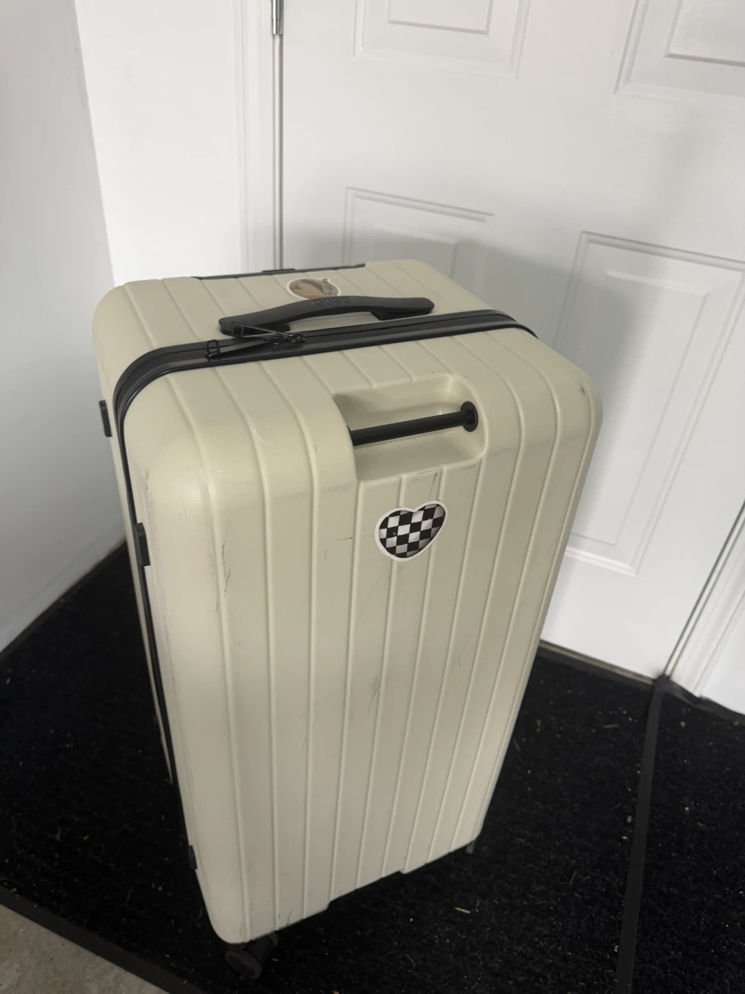 Cream coloured suitcase