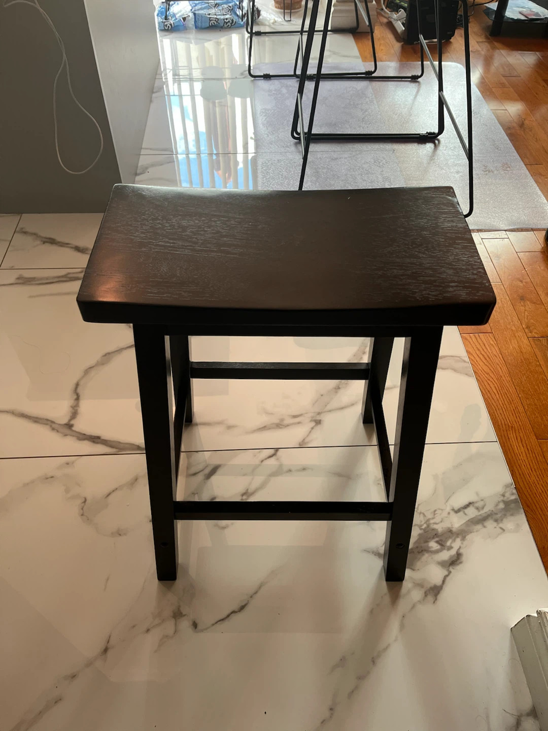 Three dark brown bar stools