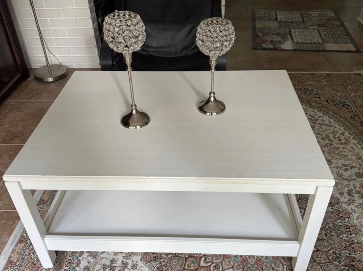 white wood coffee table with a bottom storage shelf