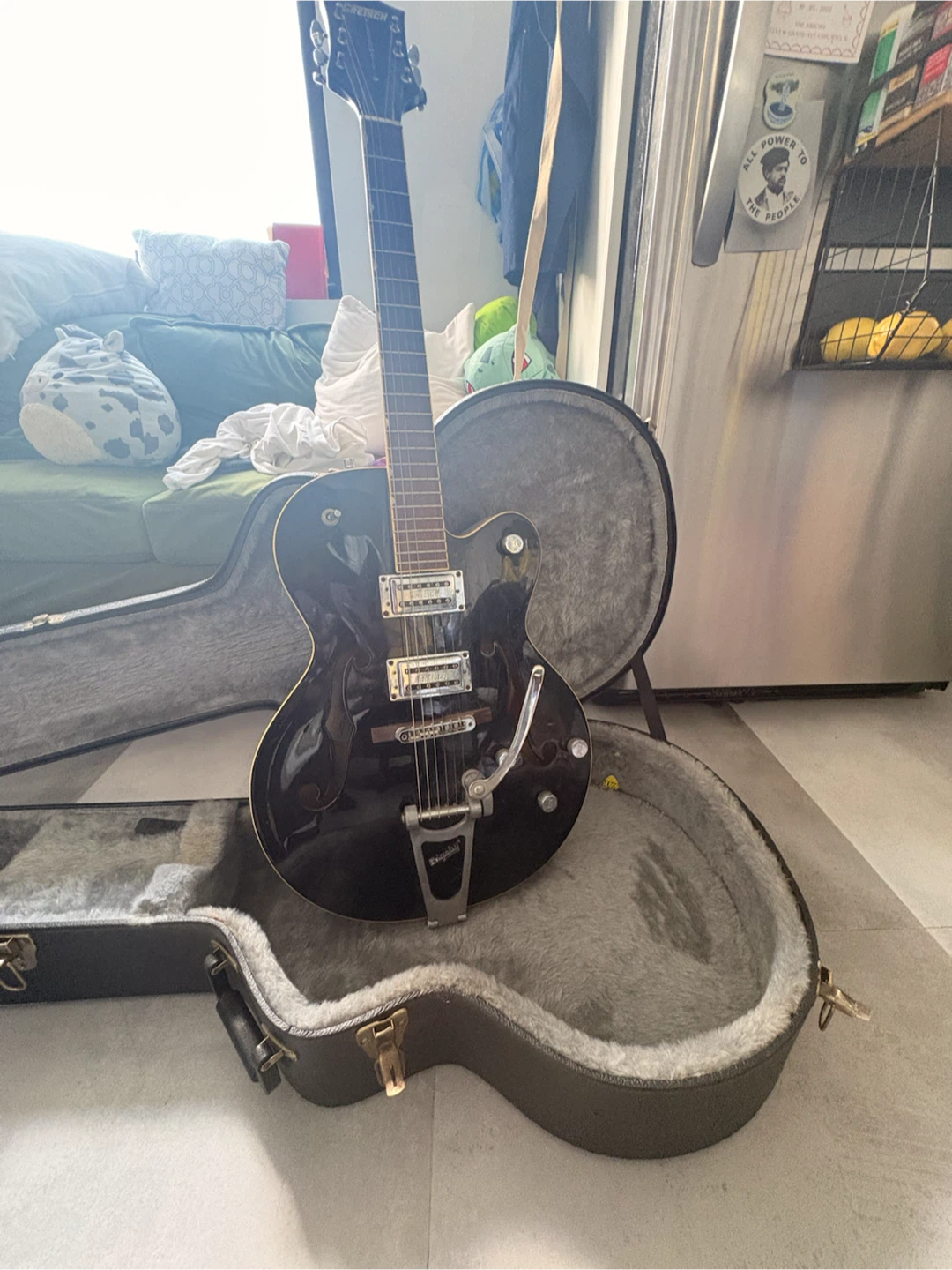 Black Gretsch G5120 with case and display rack