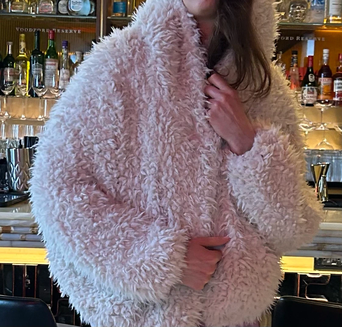 Pink fuzzy hooded jacket