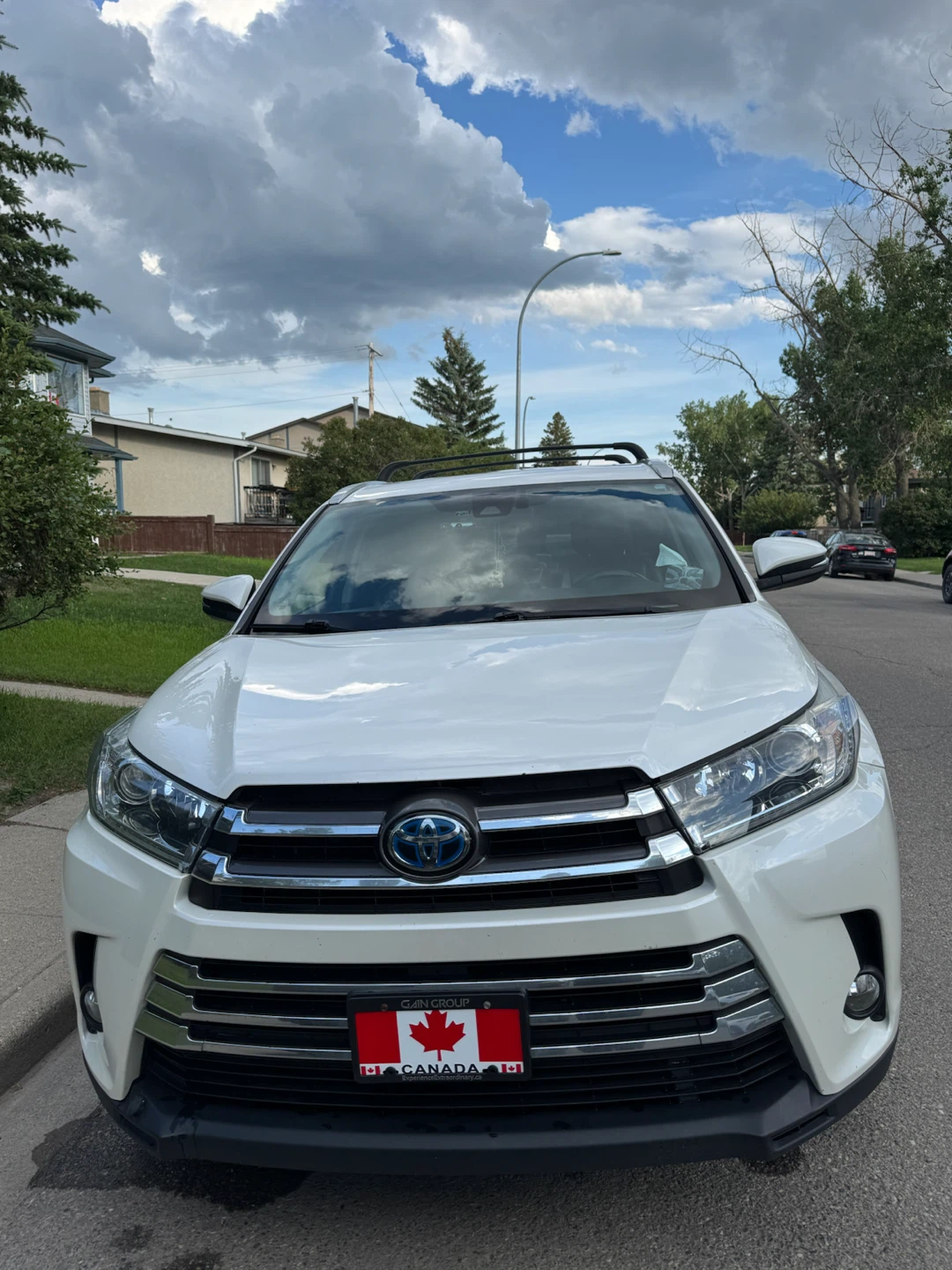 White Toyota Highlander Hybrid SUV
