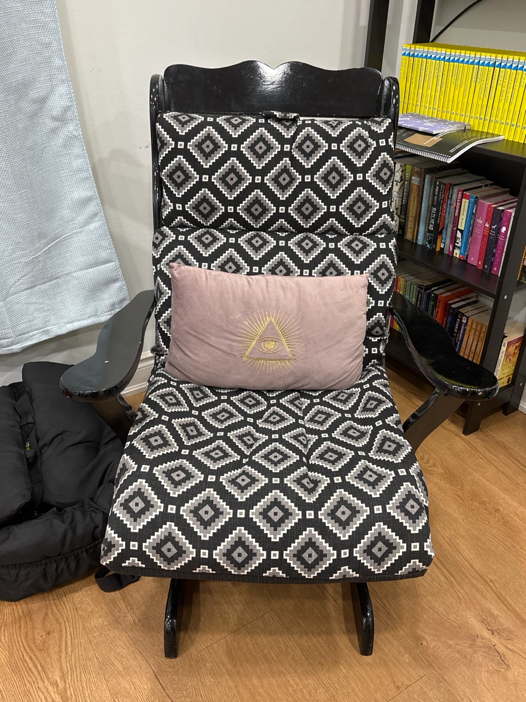Black Glider Rocking Chair with Patterned Cushions
