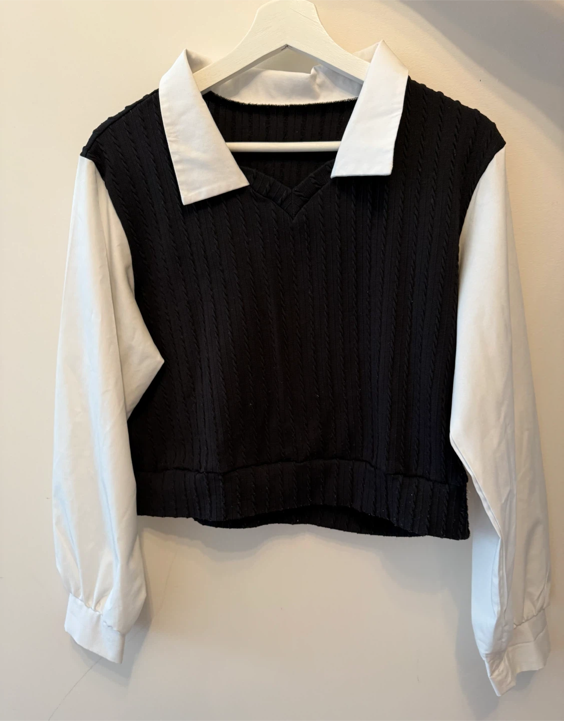 Cable-knit sweater vest with collared shirt