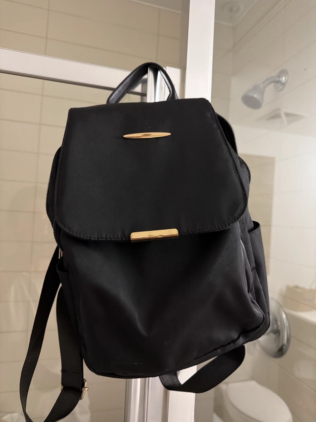 Black backpack with gold accents