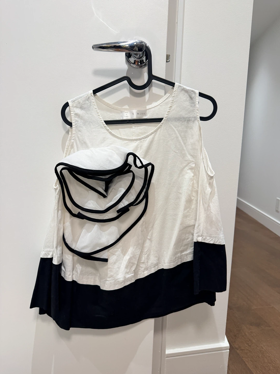 9. Nine White & Black Ruffle Top