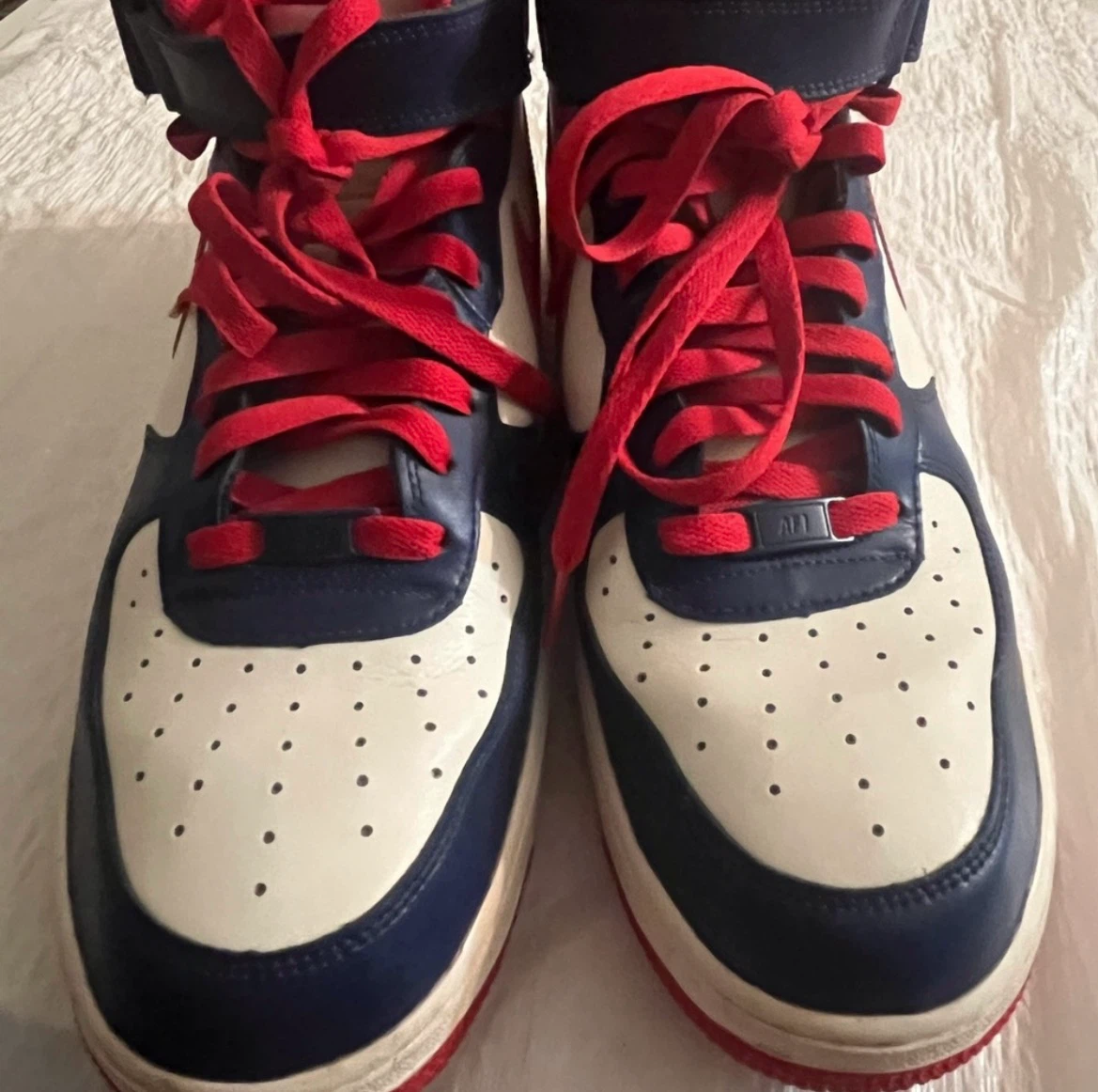 Nike Air Force High-Top Sneakers.