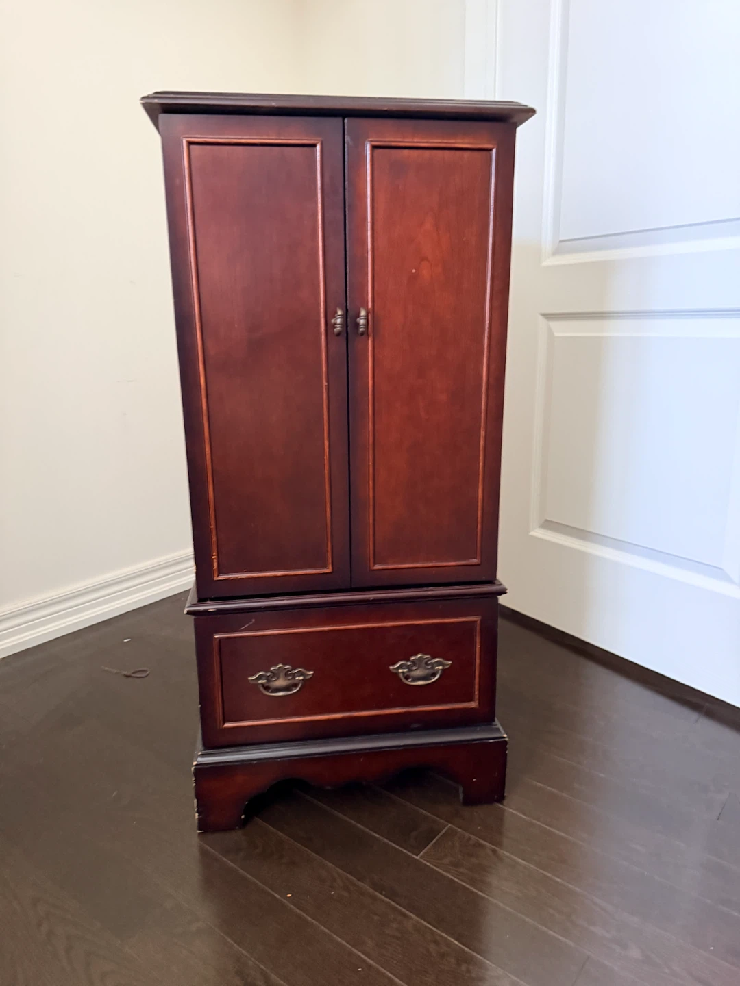 Bombay company jewelry cabinet with drawer and hooks.