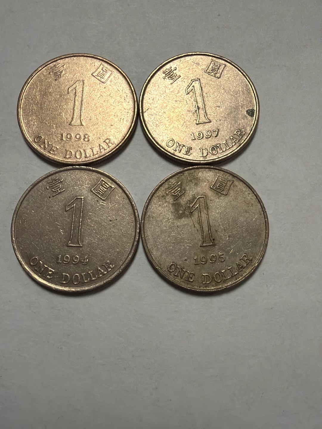 Four Hong Kong One Dollar Coins (1994, 1995, 1997, 1998)