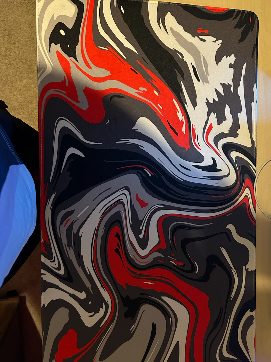 Large gaming mousepad with abstract red, black, and white design