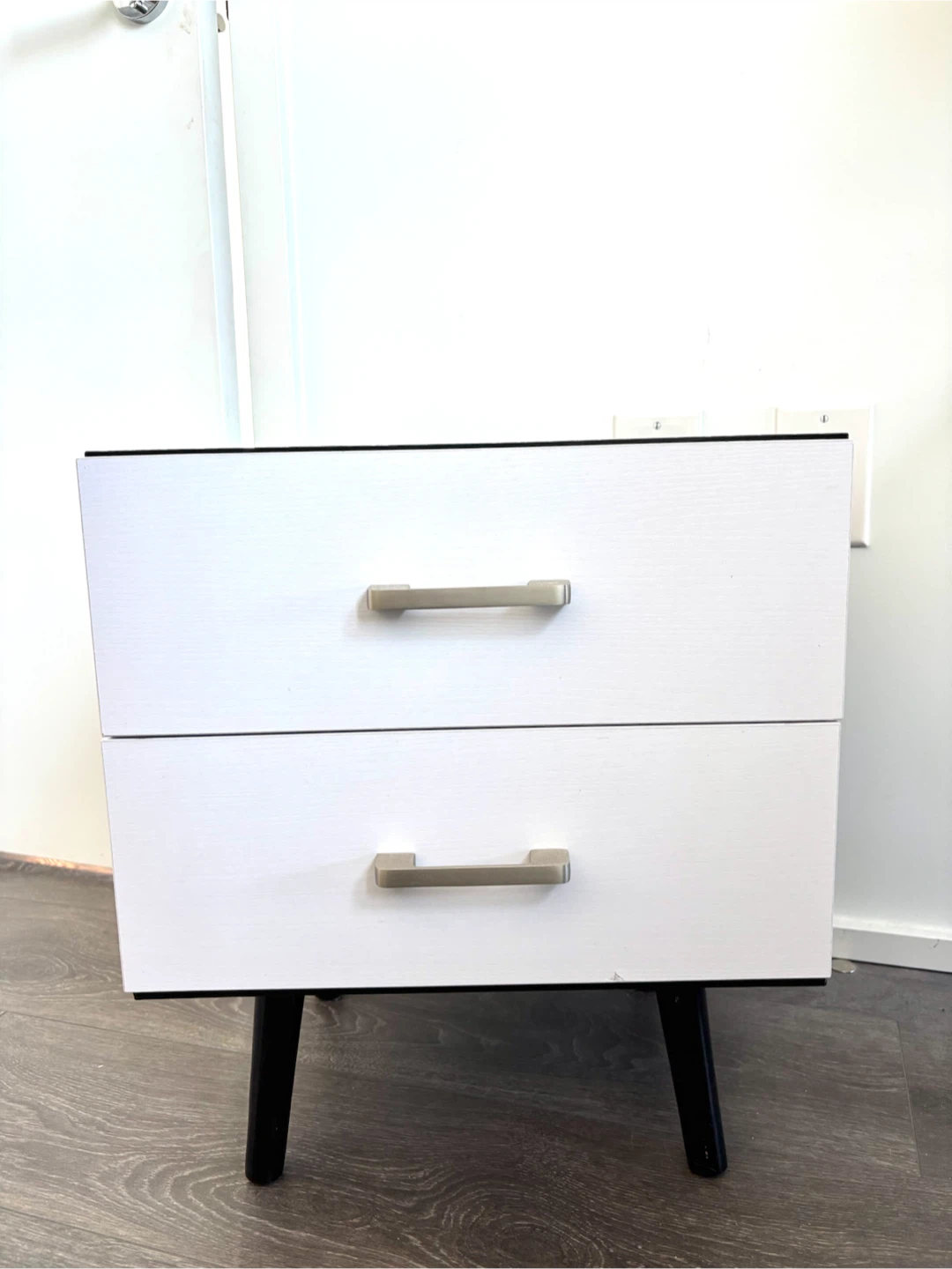 Two-drawer nightstand with black wood top