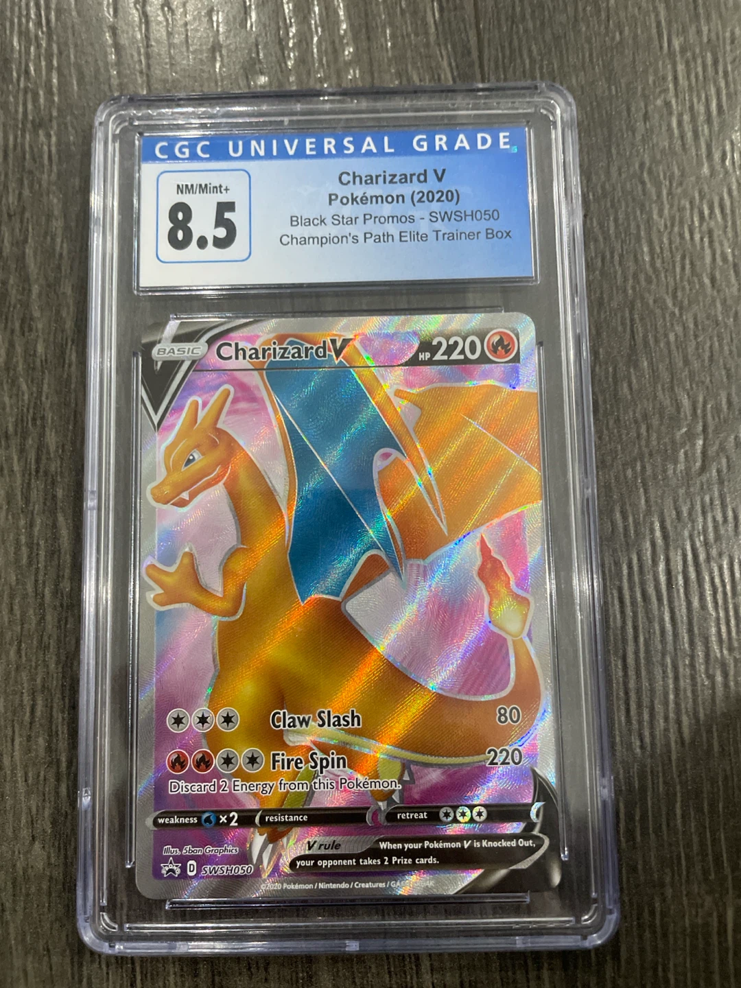 CGC Graded Charizard V Pokémon Card (SWSH050) - 8.5 NM/Mint+