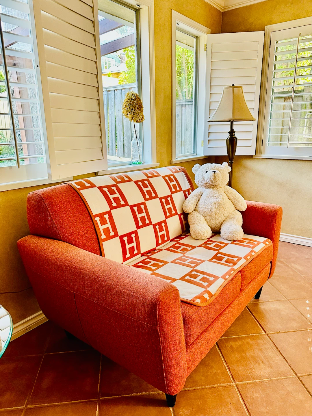 Orange 2-seater Sofa with H patterned Blanket - photo 5