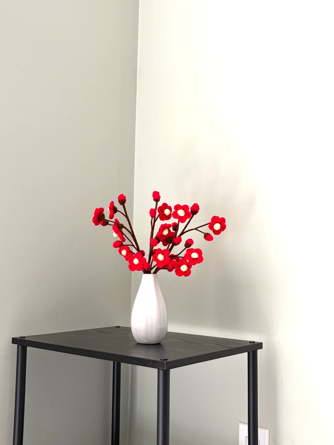 White Ceramic Vase with Red Cherry Blossoms