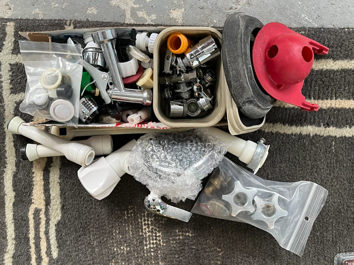 Assorted Plumbing Fixture Parts and Toilet Flapper
