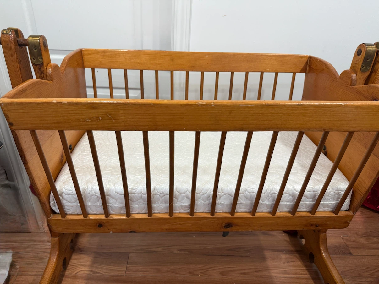 Vintage wooden baby cradle with bed