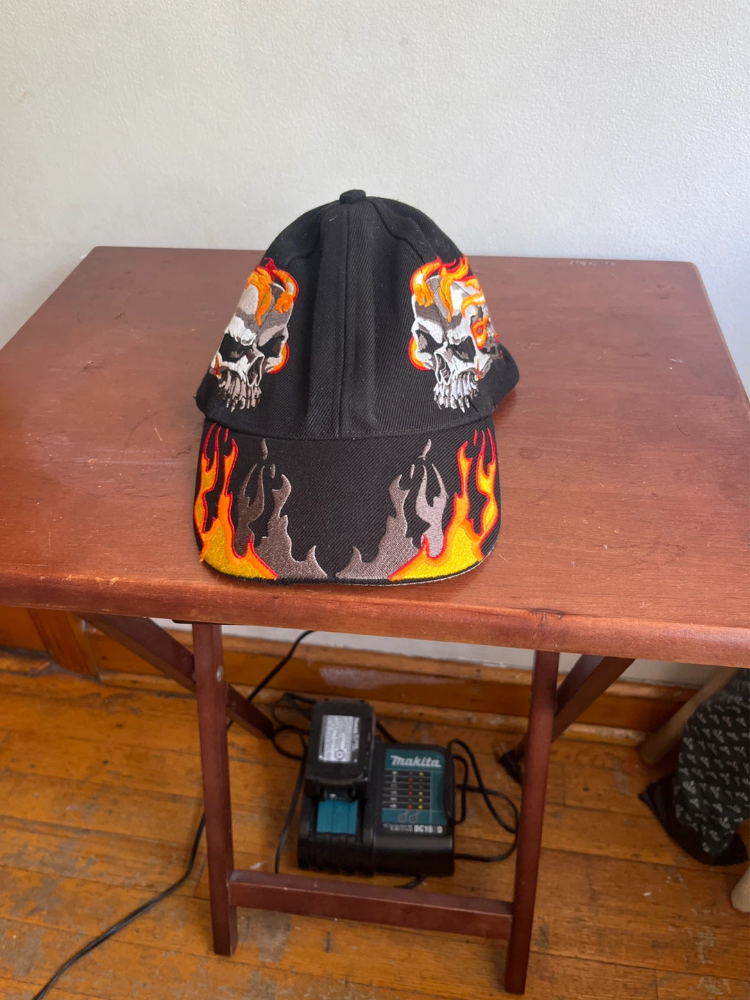 Black Baseball Cap with Skull and Flames Design