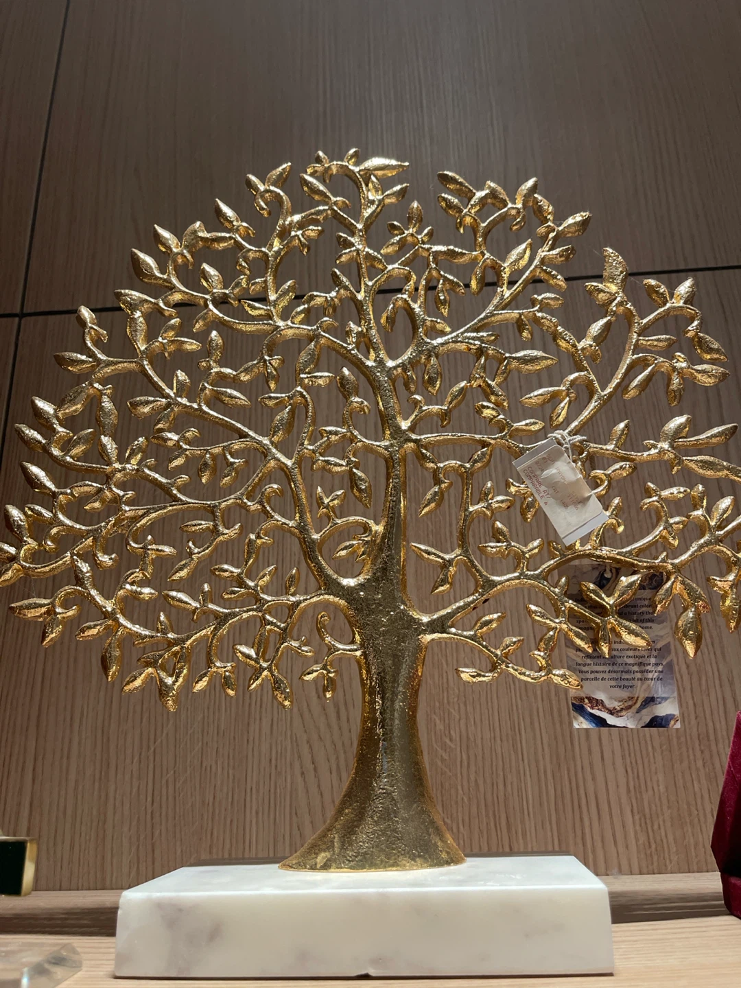 Gold decorative tree sculpture on marble base