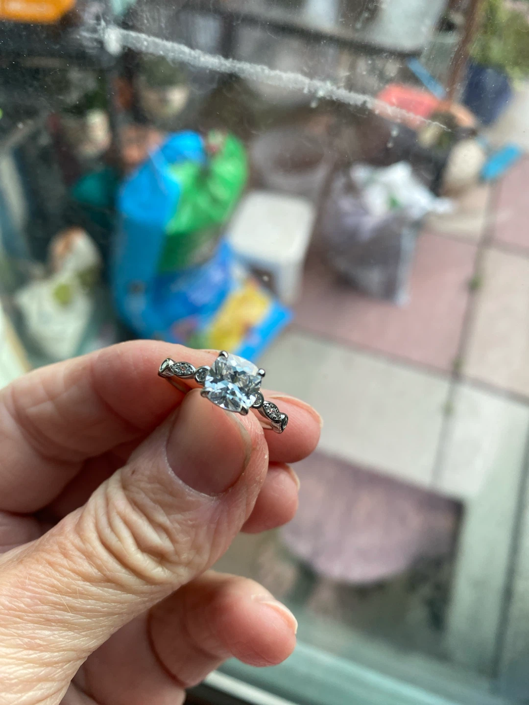 Silver engagement ring with clear stone
