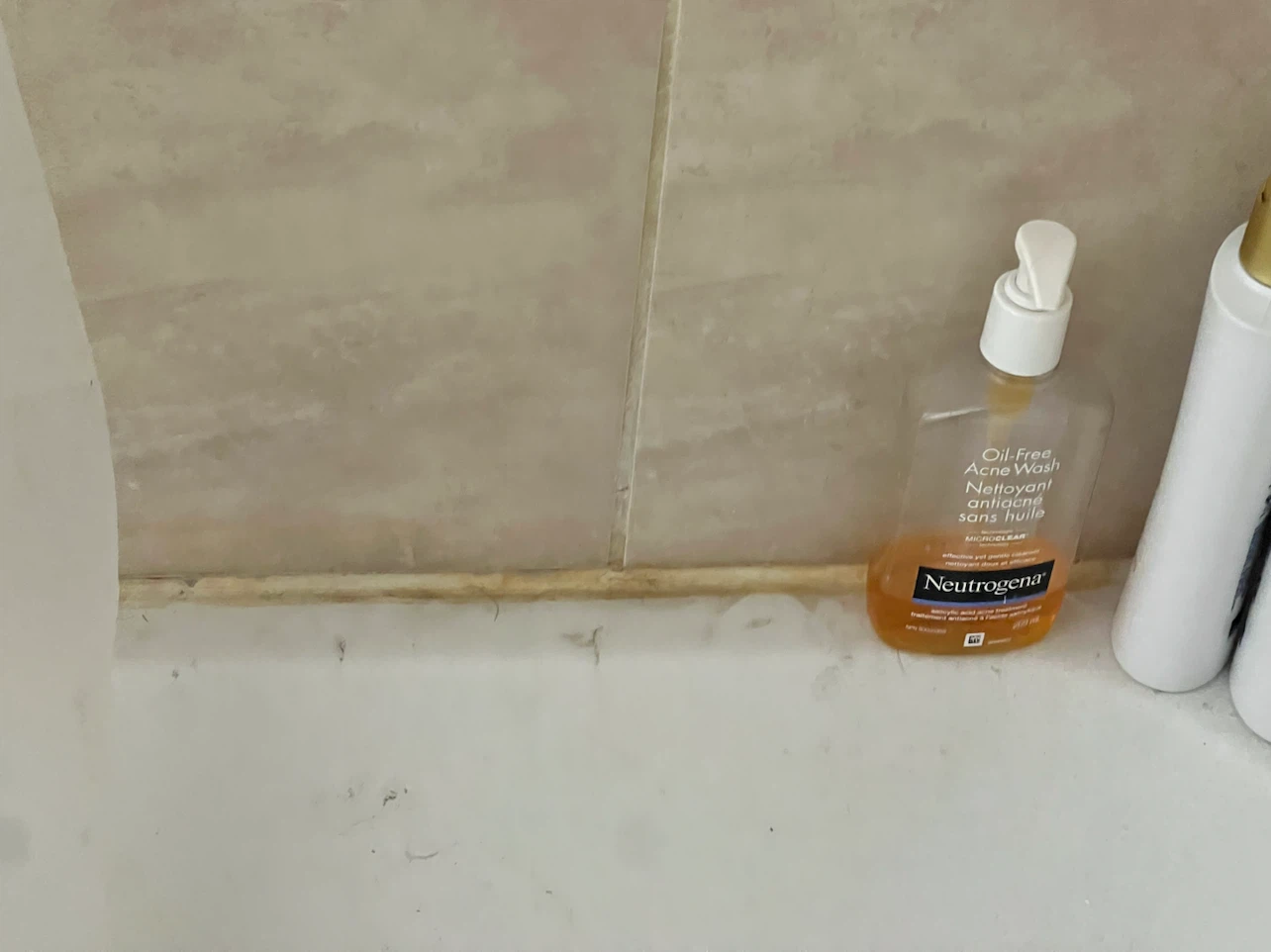 Bathroom caulking clean up - photo 2