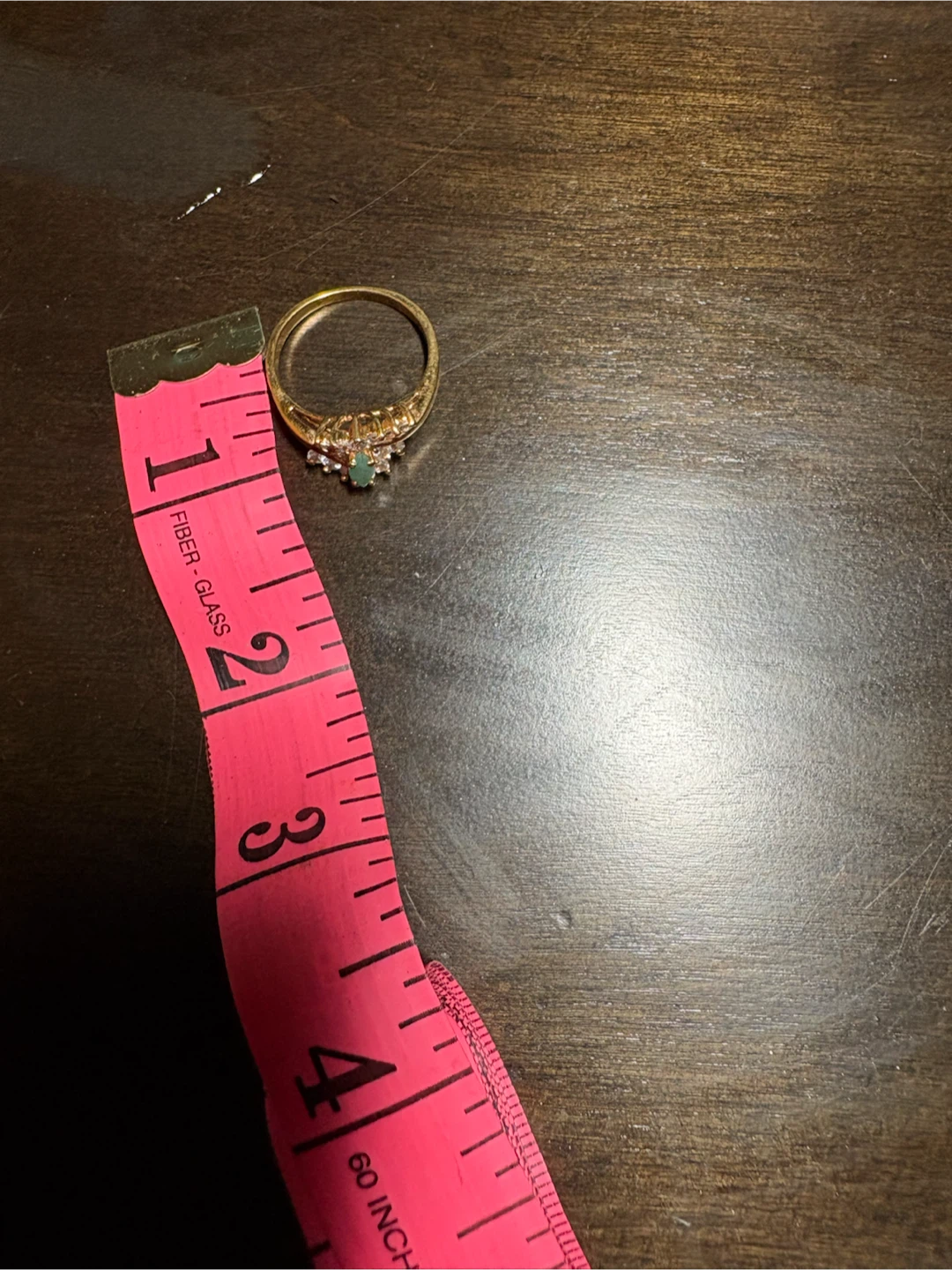 Gold ring with emerald and diamonds