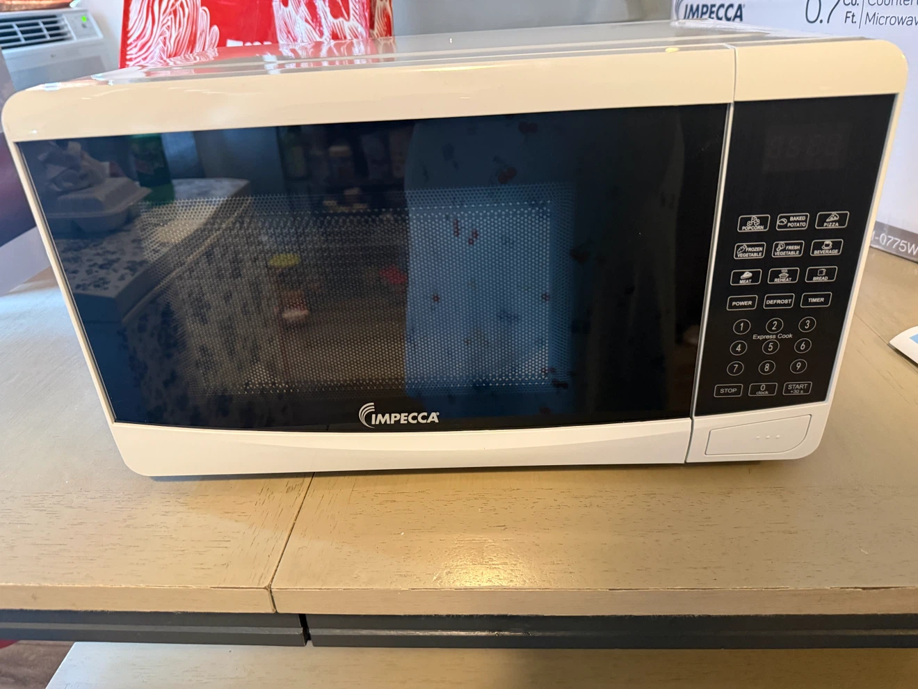 Impecca 0.7 Cu. Ft. Countertop Microwave CM-0775W