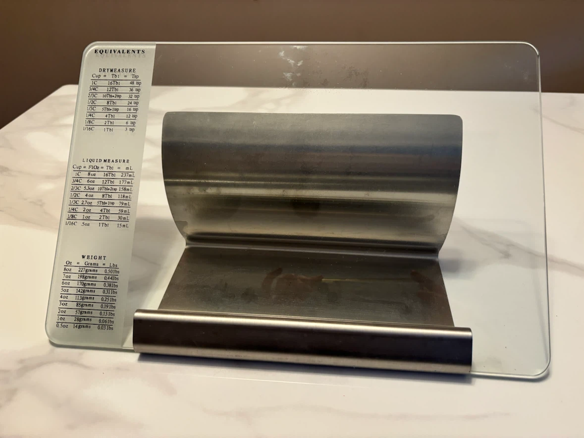 Glass cookbook stand with equivalents measurement guide